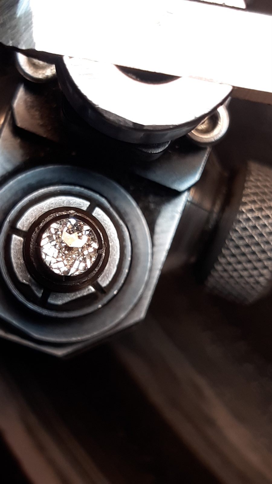Diamond under magnifier during the cutting process